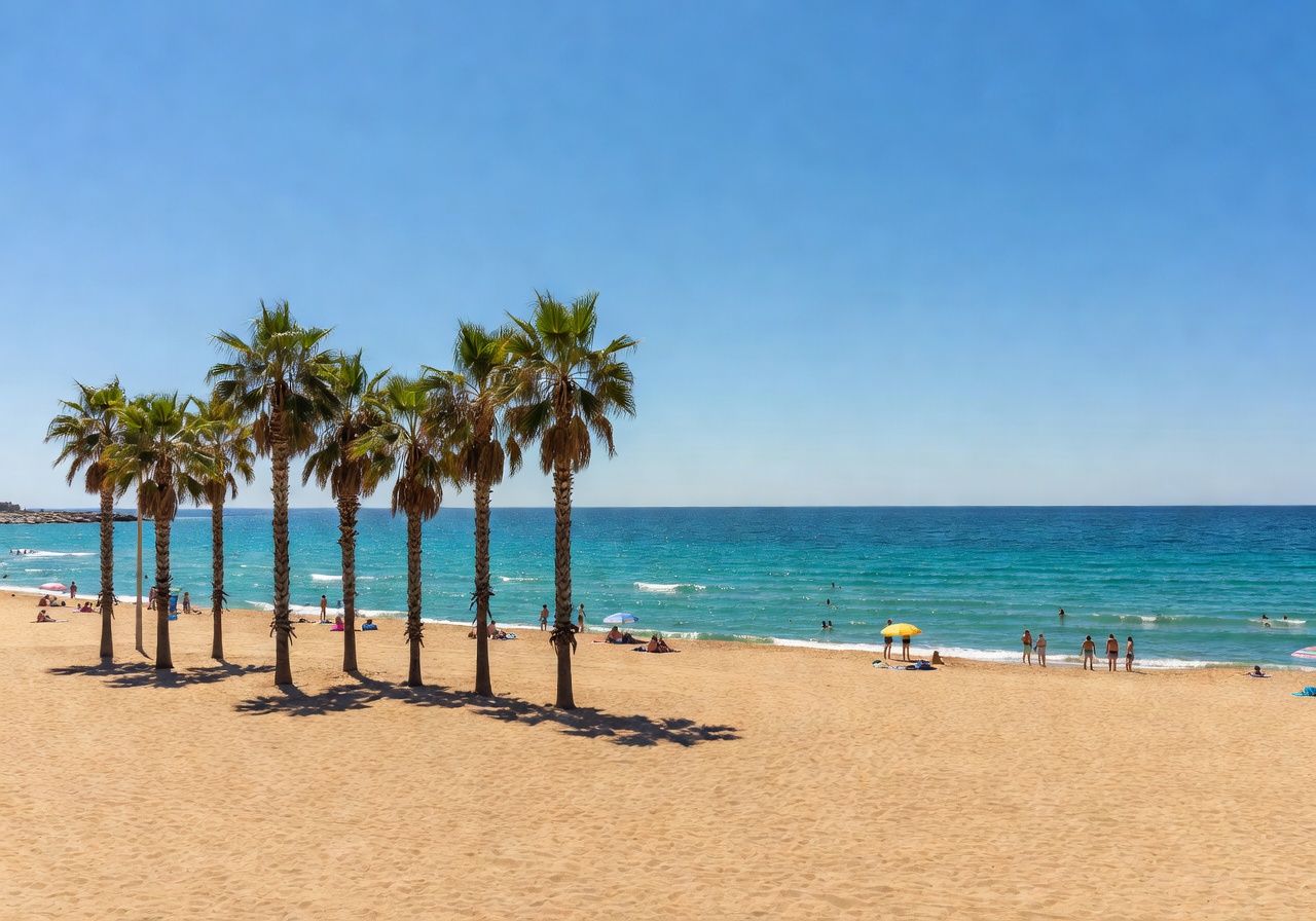 Barceloneta Beach with palm trees and Mediterranean Sea on sunny day