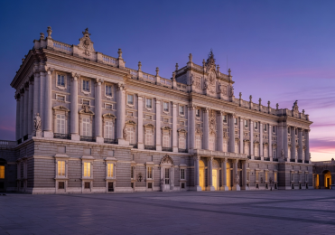Royal Palace of Madrid at twilight with ornate Baroque facade